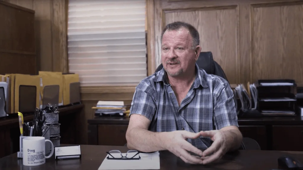 Doug Kasper sitting at his desk