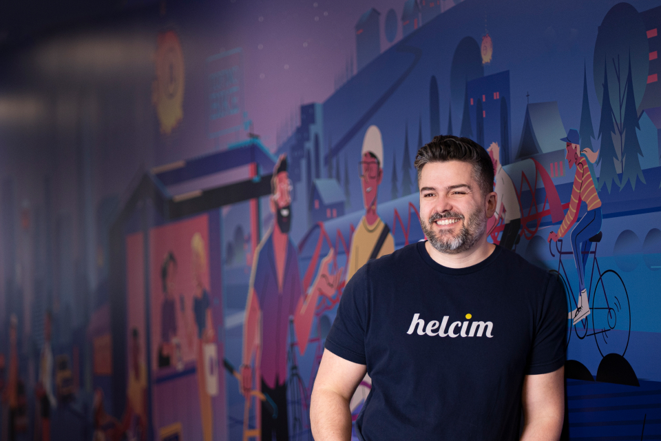 A photo of CEO and Founder Nic Beique standing against our head office mural