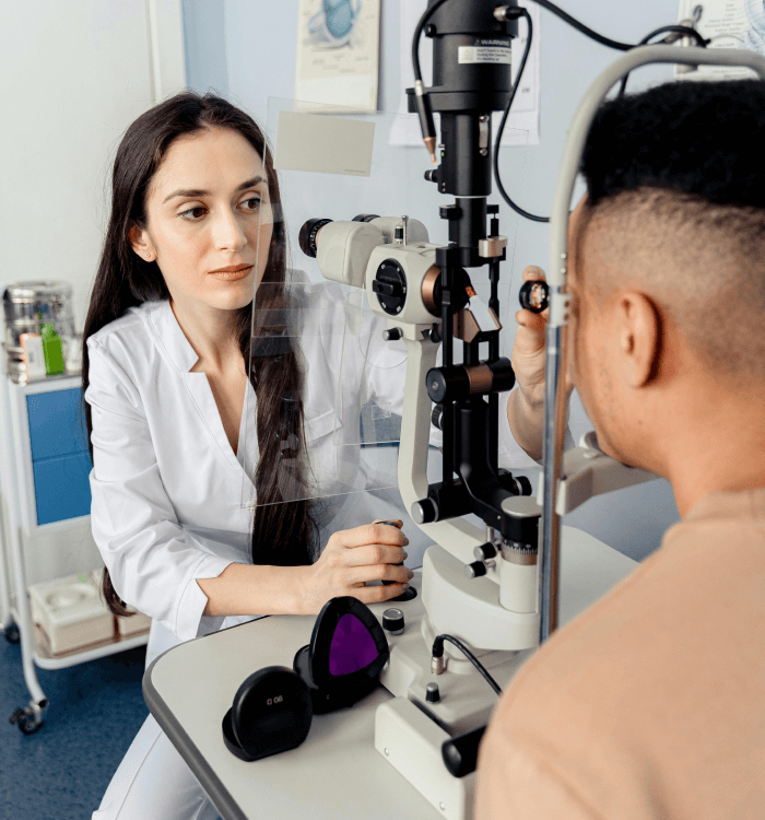 A veterinarian taking care of a cat