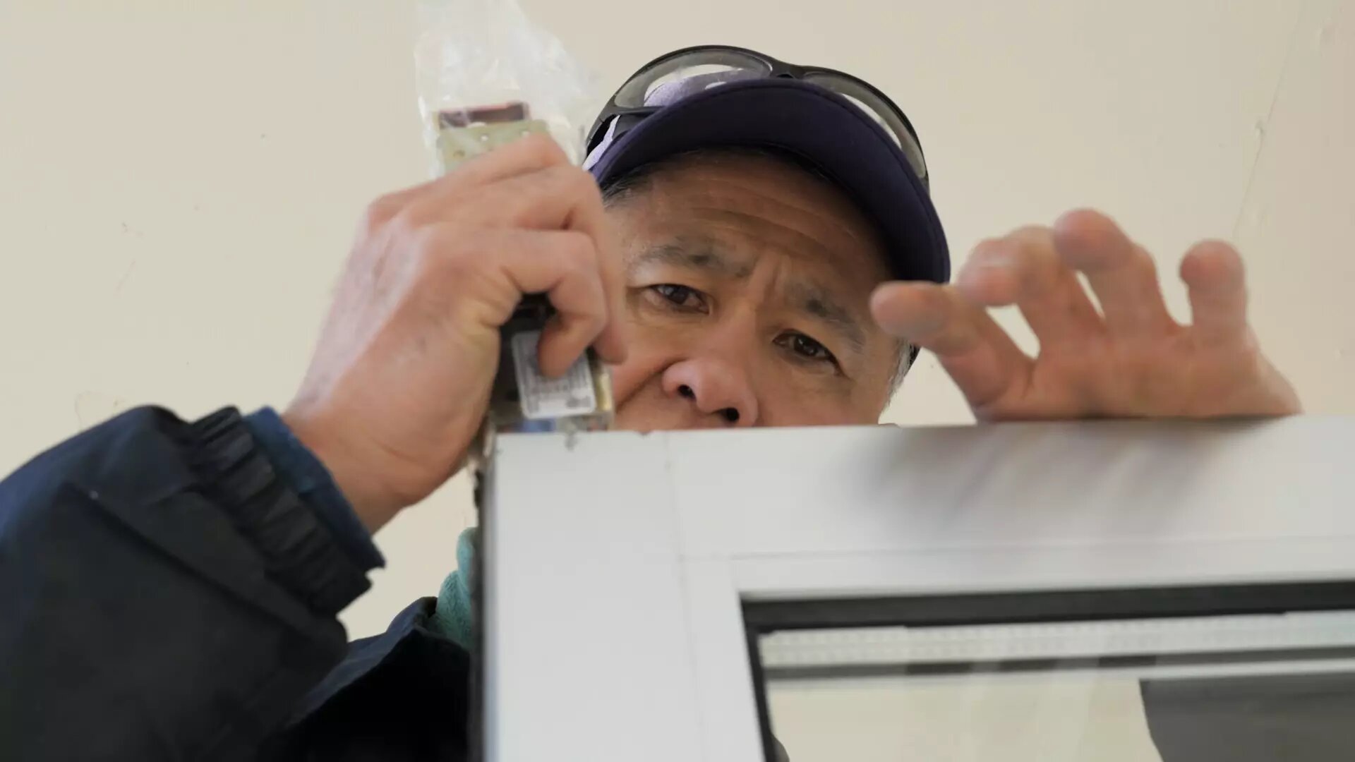 Professional locksmith working on his craft
