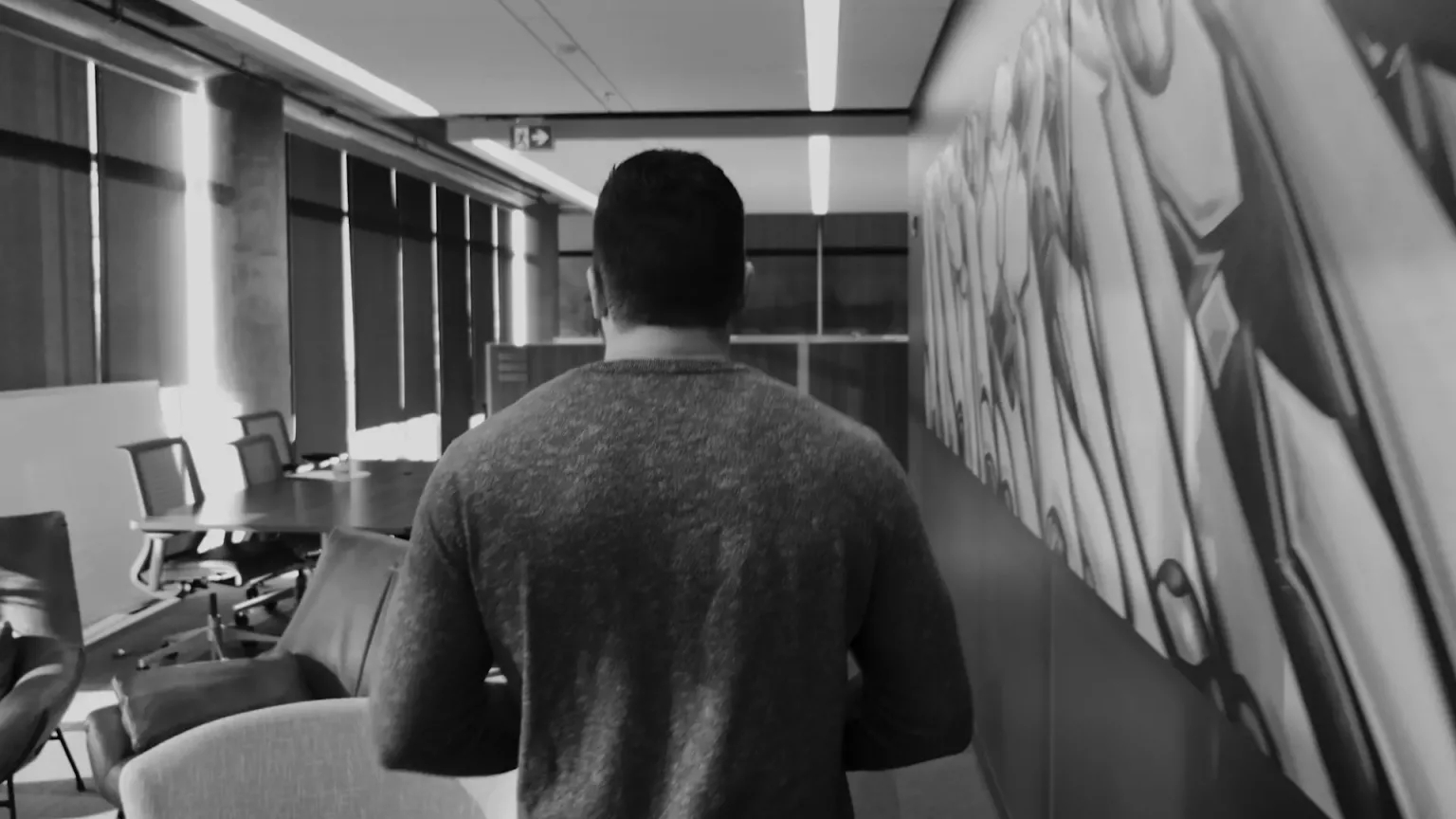 Nic Beique walking through the Helcim office